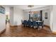 Elegant dining room with a large table, stylish chairs, and stunning natural light at 5699 Northwood Dr, Evergreen, CO 80439