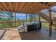 Relax in this hot tub with scenic mountain views and a wood-covered deck on a sunny day at 5699 Northwood Dr, Evergreen, CO 80439