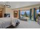 Cozy main bedroom with fireplace, sitting area and scenic views at 5699 Northwood Dr, Evergreen, CO 80439