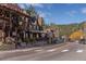 Street view of the town with small shops and local businesses on a sunny day at 5699 Northwood Dr, Evergreen, CO 80439