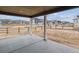 View from the back patio of the neighborhood, with a wood fence separating the yard from the street at 574 Penn Rd, Elizabeth, CO 80107