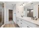 Bathroom featuring double vanity with modern fixtures and large mirror at 574 Penn Rd, Elizabeth, CO 80107