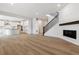 Open concept living area leading to a kitchen with white cabinetry at 574 Penn Rd, Elizabeth, CO 80107