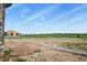 The expansive backyard shows plenty of room for activities and potential development at 634 County Road 37, Brighton, CO 80603