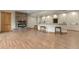 Basement features a stone fireplace, a bar area with stools, and recessed lighting at 634 County Road 37, Brighton, CO 80603