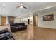 Finished basement featuring a stone fireplace, wet bar, and wood flooring at 634 County Road 37, Brighton, CO 80603