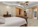 Primary bedroom features a fireplace and wood closet doors at 634 County Road 37, Brighton, CO 80603
