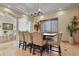 Dining room features a stylish chandelier, large windows and decorative columns at 634 County Road 37, Brighton, CO 80603