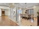 Open floor plan dining room showcasing elegant columns and comfortable seating at 634 County Road 37, Brighton, CO 80603