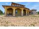 Luxury home featuring stucco siding, stone accents, and covered patio at 634 County Road 37, Brighton, CO 80603