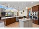 Spacious kitchen with stainless steel appliances, white countertops, and wooden cabinets at 634 County Road 37, Brighton, CO 80603