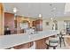 Spacious kitchen with a large island, stone accents, and modern fixtures at 634 County Road 37, Brighton, CO 80603