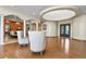 Open floor plan featuring tall ceilings, hardwood flooring and beautiful architectural features at 634 County Road 37, Brighton, CO 80603