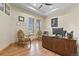 Home office with wood floors, a desk, and a large window with views of the outside at 634 County Road 37, Brighton, CO 80603