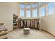 Bright walk-in closet with high ceilings, and a variety of clothes and shoe shelving at 634 County Road 37, Brighton, CO 80603