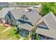 An aerial view of the house with nice landscaping, porch, and updated roof at 1208 S Pennsylvania St, Denver, CO 80210