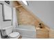 Cozy bathroom featuring tile surround, soaking tub, shower and toilet at 1208 S Pennsylvania St, Denver, CO 80210