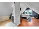 Bedroom showing vaulted ceilings, access to the bath and lots of natural light at 1208 S Pennsylvania St, Denver, CO 80210