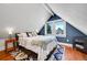 Charming bedroom features a cozy rug, a window nook and vibrant pops of blue paint at 1208 S Pennsylvania St, Denver, CO 80210
