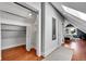 Hallway features hardwood floors, an open closet and access to other rooms at 1208 S Pennsylvania St, Denver, CO 80210