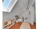 Attic hallway featuring natural lighting, hardwood floors and railing at 1208 S Pennsylvania St, Denver, CO 80210