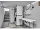 Functional laundry area with stacked washer and dryer, and a folding table for convenience at 1208 S Pennsylvania St, Denver, CO 80210