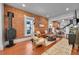 Bright living room with exposed brick wall and modern furniture at 1208 S Pennsylvania St, Denver, CO 80210
