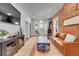 Spacious living room with modern decor and exposed brick wall detail at 1208 S Pennsylvania St, Denver, CO 80210