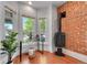 Cozy living room with large windows and a sleek fireplace at 1208 S Pennsylvania St, Denver, CO 80210