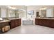 Spa-like bathroom with dual vanities, soaking tub, and elegant fixtures, showcasing modern design and comfort at 22609 E Eads Cir, Aurora, CO 80016