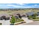 Beautifully landscaped home featuring a stone and siding facade, complemented by a well-maintained lawn and mature trees at 22609 E Eads Cir, Aurora, CO 80016