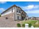 Home's exterior features stone accents and well-manicured landscaping, blending seamlessly with the natural surroundings at 22609 E Eads Cir, Aurora, CO 80016