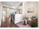 Hallway with hardwood floors, an armchair and views of the neighborhood at 22609 E Eads Cir, Aurora, CO 80016