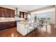 Gourmet kitchen flows to the dining area, featuring a large island and stainless steel appliances at 22609 E Eads Cir, Aurora, CO 80016