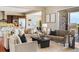 Open-concept living room connecting the kitchen with comfortable seating at 22609 E Eads Cir, Aurora, CO 80016