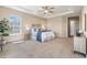Tranquil main bedroom, featuring tray ceilings, plush carpeting, and soft neutral colors creating a serene retreat at 22609 E Eads Cir, Aurora, CO 80016