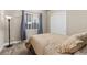 Cozy bedroom featuring carpet, window with blinds, and a comfortable bed at 22646 E Glidden Dr, Aurora, CO 80016