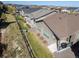Home exterior featuring a landscaped yard, stone accents, and a cozy covered patio at 22646 E Glidden Dr, Aurora, CO 80016