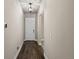 Hallway with hardwood floors, light colored walls, and a front door at 22646 E Glidden Dr, Aurora, CO 80016