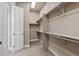 Walk-in closet with carpet and built-in shelving for optimal storage at 22646 E Glidden Dr, Aurora, CO 80016