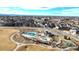 Aerial view showcasing the community pool, park, and surrounding neighborhood at 11442 Booth Falls Ct, Parker, CO 80134