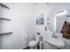 Clean powder room featuring a modern sink, round mirror, and floating shelves at 11442 Booth Falls Ct, Parker, CO 80134