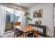 Bright dining room with a wooden table, elegant decor, and sliding glass doors at 11442 Booth Falls Ct, Parker, CO 80134