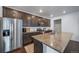 Modern kitchen featuring stainless steel appliances, granite countertops, and ample cabinet space at 11442 Booth Falls Ct, Parker, CO 80134