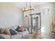 Bright living room with a comfortable couch, modern lighting, and decorative mirrors at 11442 Booth Falls Ct, Parker, CO 80134