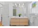 Modern bathroom with double vanity, sleek wood cabinets, and contemporary fixtures at 2643 N Marion St, Denver, CO 80205