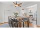 Dining area with large table open to the kitchen, perfect for entertaining guests at 2643 N Marion St, Denver, CO 80205