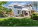 Blue single-Gathering home with manicured lawn, fenced yard, and mature trees at 2643 N Marion St, Denver, CO 80205