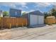 Spacious two-car garage with white doors and ample driveway parking at 2643 N Marion St, Denver, CO 80205