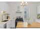 Charming kitchen with white cabinets, stainless steel appliances, and butcher block countertops at 2643 N Marion St, Denver, CO 80205